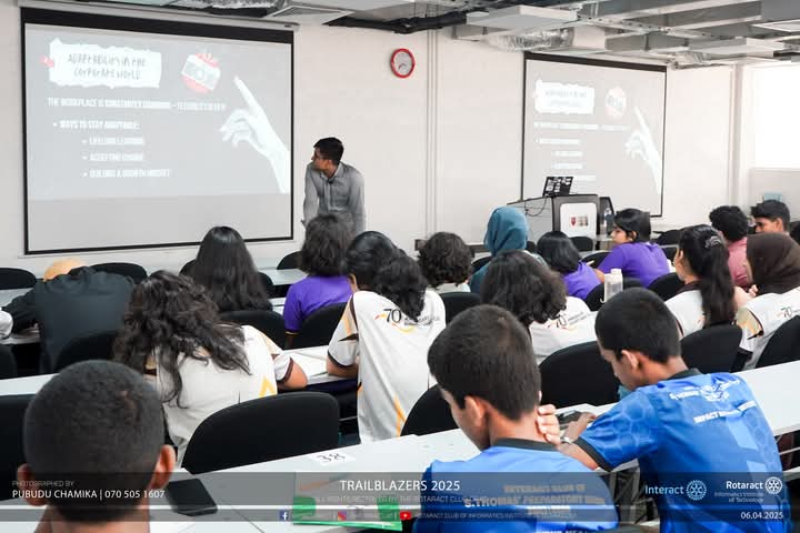 Senith presenting to a large audience